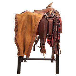 FAENA SADDLE MEXICO, 20TH CENTURY Smooth saddle, chaps, breastplate