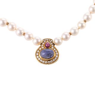 A Pearl Necklace with Ruby & Iolite Pendant