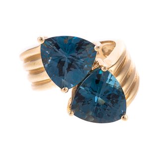 A Large Blue Topaz Bypass Ring in 14K
