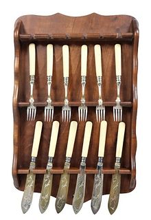Collection of Forks & Knives on Wooden Rack