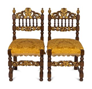 A Pair of Spanish Baroque Style Parcel-Gilt Walnut Slipper Chairs
Height 30 3/4 x width 16 x depth 15 inches.