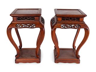 A Pair of Chinese Pierce-Carved Rosewood Stands
Height 18 x width 12 1/2  x depth 12 1/2 inches.