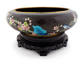A Chinese Cloisonne Circular Bowl
Height 5 x diameter 15 inches; height of stand 3 1/2 inches.