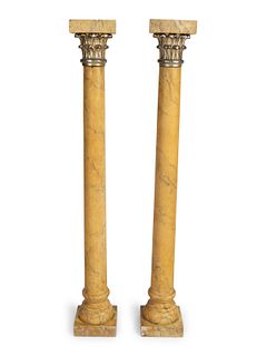 A Pair of Neoclassical Style Parcel-Gilt and Faux Marbre Small Pedestals
Height 43 1/2 x width 6 x depth 6 inches.