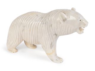A Carved and Polished White Marble Figure of a Polar Bear
Height 8 1/4 x length 14 x width 4 inches.