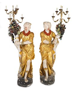 A Pair of Italian Baroque Style Parcel-Gilt and Carved Wood and Gesso Figural Candelabra
Height 74 inches.