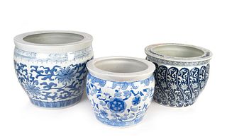 Three Chinese Blue and White Porcelain Jardinieres
Height 12 to 16 1/2 inches; diameters 14 1/2 to 18 inches.