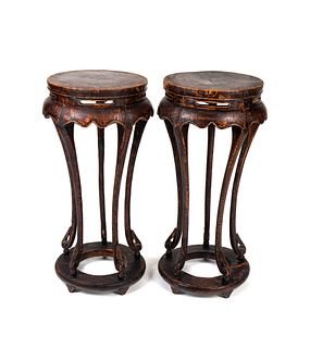 A Pair of Chinese Stained Wood Stands
Height 37 x diameter 18 inches.