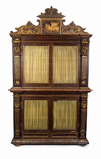 An Italian Neoclassical Parcel-Gilt and Carved Walnut Bookcase
Height 107 1/2 x width 63 x depth 17 inches.