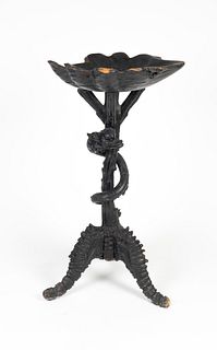 An Italian Carved Wood Snake-Entwined Grotto Table
Height 35 x width 19 inches.