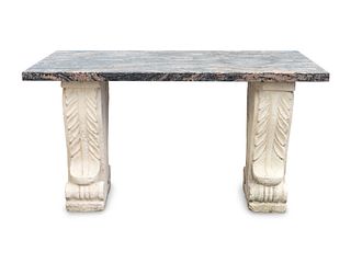 A Neoclassical Style Cast-Stone and Granite Table
Height 39 x length 50 x depth 33 1/2 inches.