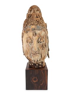 A Chinese Weathered Wood Head of Guanyin
Height 14 x widtj 7 x depth 7 inches.