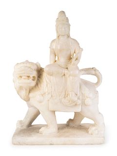 A Chinese Marble Figure of Guanyin Seated on a Fu Lion
Height 18 x width 12 1/4 x depth 5 inches