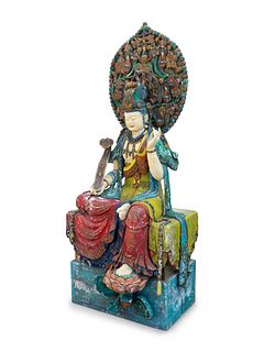 A Large Polychromed Wood Figure of Seated Guanyin
Height 84 x width 36 x depth 31 inches.