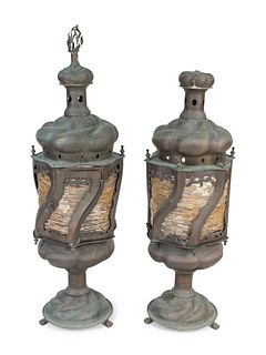 A Pair of Middle Eastern Patinated Metal And Beaded Glass Lanterns
Height 36 x diameter 10 1/2 inches.