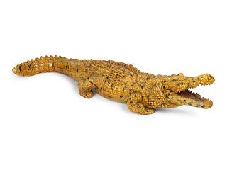 An Italian Glazed Pottery Crocodile
Height 8 x length 53 x width 12 inches.