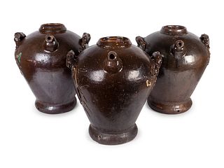 Three Chinese Brown-Glazed Pottery Water Jugs
Height 18 1/2 x diameter 17 1/2 inches.