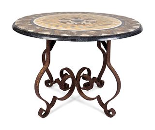An Italian Scagliola and Specimen Marble-Veneered Table Top on a Wrought-Iron Base
Height 27 1/2 x diameter 38 inches.  