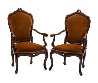 A Pair of Venetian Carved Walnut Armchairs
Height 42 x width 26 x depth 23 inches.
