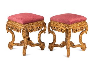 A Pair of Italian Baroque Style Giltwood Stools
Height 24 x width 18 1/2 x depth 18 1/2 inches.