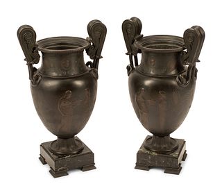 A Pair of Pompeiian Style Bronze Urns
Height 21 inches.
