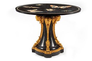 A Parcel Gilt Specimen Marble Center Table
Height 32 x diameter of top 44 inches.