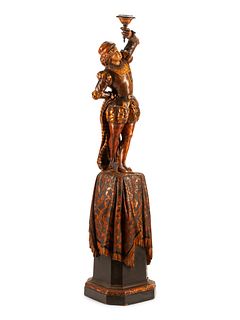 An Austrian Carved Wood Figural Torchere
Height 75 inches.