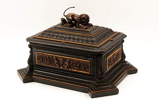 An Austrian Carved and Ebonized Wood Table Casket with a Lion
Height 11 x width 19 x depth 15 inches.