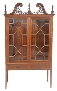 Margolis Mahogany China Cabinet having pierced carved and broken arch top with two glazed doors on base, with two drawers set on inlaid square, tapere