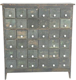Thirty-Six Drawer Apothecary Cabinet with porcelain pulls set on boot jack ends in old blue paint, front bottom kick board replaced, height 53 inches,