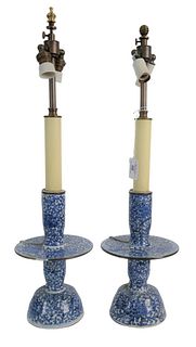 Pair of Chinese Blue and White Porcelain Candlesticks made into table lamps having scrolling leaf and flowers, height 22 inches.