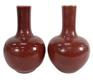 Pair of Chinese Bottle Form Oxblood Langyao Vases, one with a gilt rim and base, both marked with 6 character Kangxi Reign mark character to underside