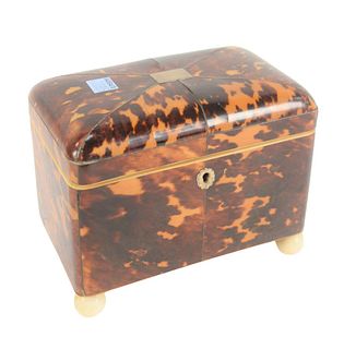 Regency Tortoiseshell Tea Caddy, having silver inlay, lift top opening to two fitted compartments with covers, height 5 1/2 inches, length 7 inches.