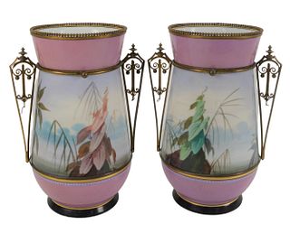 Pair of Paris Porcelain Vases mounted with metal handles, top rim having hand painted hummingbird, height 10 1/4 inches, diameter 5 1/4 inches.