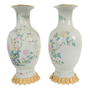 Pair of Chinese Famille Rose Vases mounted as lamps, having painted chrysanthemum and rockery, Republic Period, vase height 17 inches.