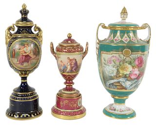 Three Porcelain Urns to include two Royal Vienna and one Copeland, heights 9, 11 1/2 and 11 3/4 inches.
