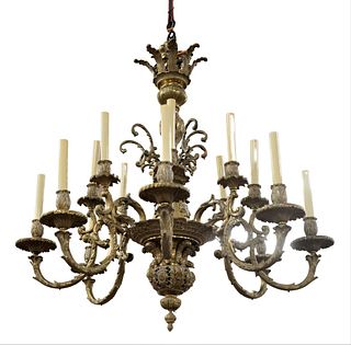 Bronze Sixteen Light Chandelier having eight foliate stylized double arms with two lights per arm, height 49 inches, diameter 36 inches. Provenance: C