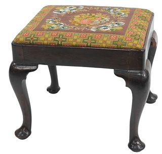 Queen Anne Walnut Footstool having rectangle top with beaded needlepoint upholstery on cabriole legs set on pad feet, possibly Pennsylvania, circa 174