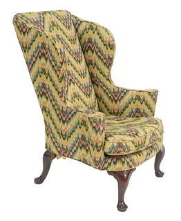 Queen Anne Upholstered Wing Chair having rolled out arms with cones and flame stitch style upholstery, all set on 4 cabriole legs ending in pad feet, 