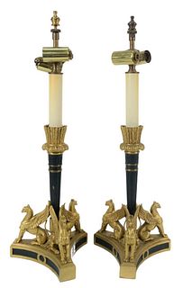 Pair of Bronze Candlesticks, having gilt bronze fletching over bronze shaft on tripod base with winged griffins, made into table lamps, height 18 1/2 