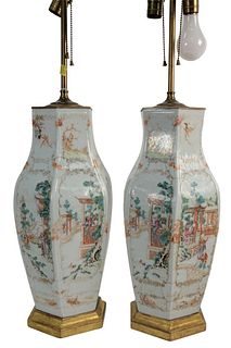Pair of Famille Rose Hexagonal Vases mounted as lamps decorated with exterior figural scenes,18th/19th century, height 18 inches.