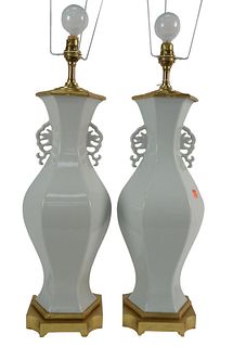 Pair of Blanc de Chine Porcelain Vases having hexagonal baluster form with stylized, pierced foliate handles, made into table lamps, vase height 17 3/