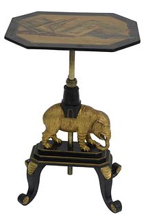 Victorian Book Stand, in black lacquer, gilt, and paint decoration, raised on elephant shaft with quad base, height 22 inches, top 13" x 16 1/2".
