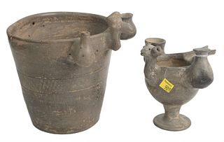 Two Ancient Pottery Vessels to include a grey vessel having one long spout on back, a small vessel on each side, and an animal head on back, on footed