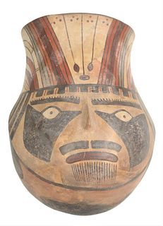 Pre-Columbian Pottery, portrait pot or vessel depicting polychrome head with face and headdress, height 10 1/2 inches, diameter 7 inches.