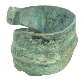 Large Bronze Greek Geometric Armband Bracelet, 8th Century B.C. or later, curved cuff with ends wrapping around and resting atop each other, central r