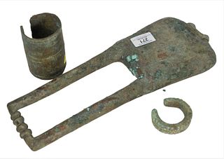 Three Ancient Bronzes, bell form instrument, Luristan or Greek, B.C. or after, length 14 1/2 inches; along with 2 bracelets or anklets, diameters 2 1/