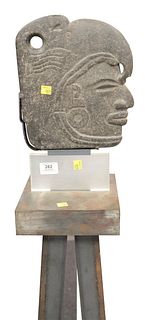 Carved Stone Bust of A Deity wearing a headdress in Egyptian taste mounted on pedestal stand, face height 10 1/2 inches, total height 59 inches.