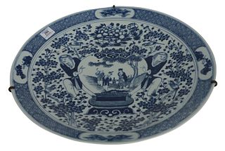 Chinese blue and white Charger depicting Hehe Erxian, brothers holding a vase, 19th century, with wire hanger, diameter 19 inches.