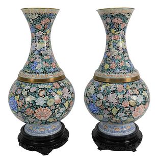 Pair of Monumental Enameled Vases having scrolling vines with leaves and blossoming flowers, height 31 inches.